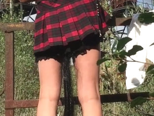 Nice ass in scotch kilt in public with ponytail