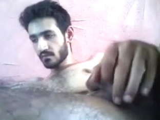 Attractive boy is frigging in the bedroom and filming himself on camera