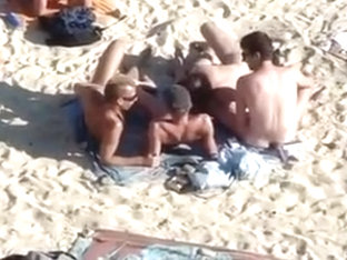 4 Guys Playing On Nude Beach