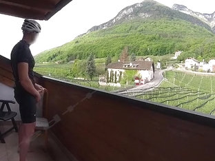 Exhibitionist cums on balcony in biking gear